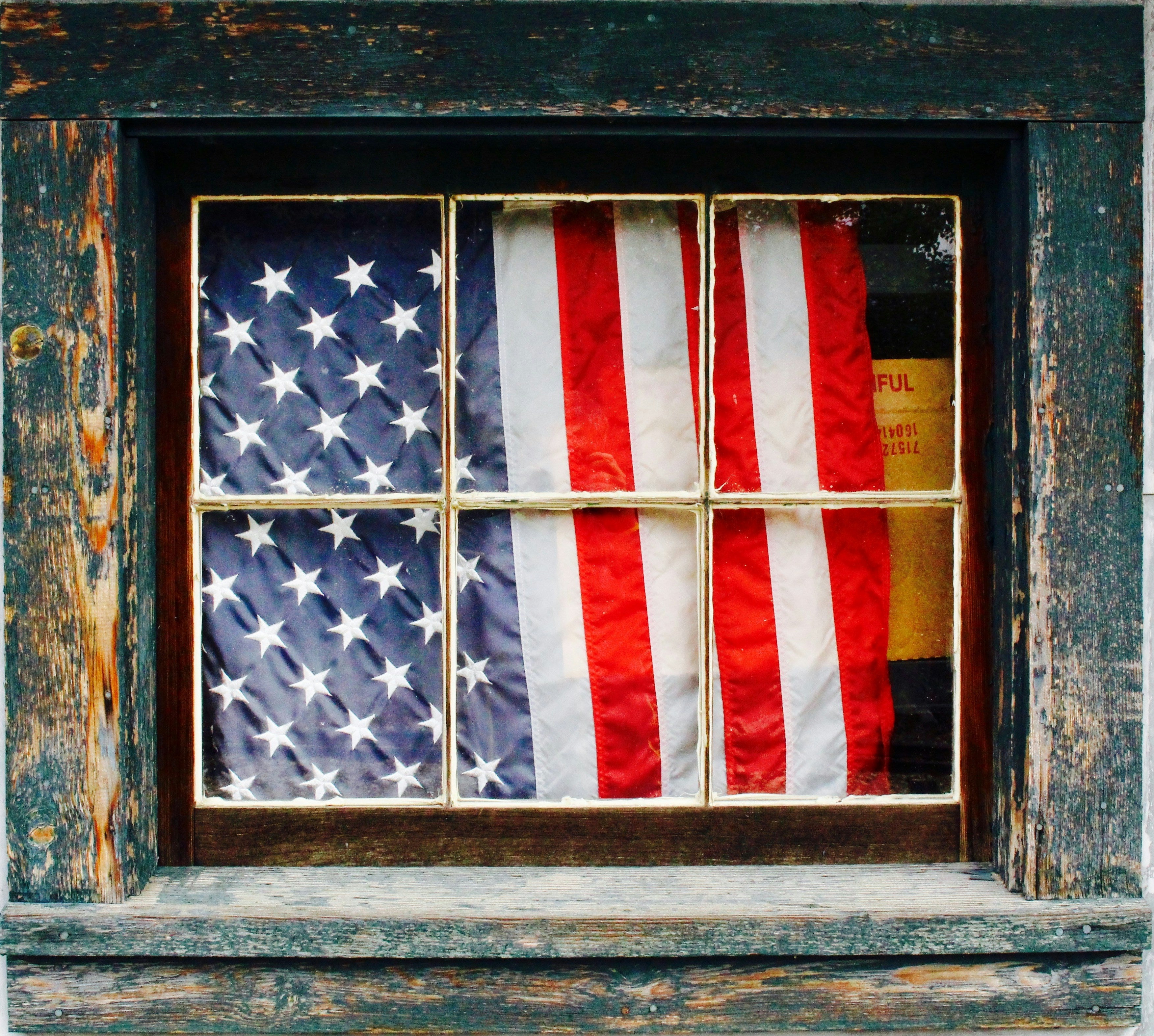 American flag hung in a window