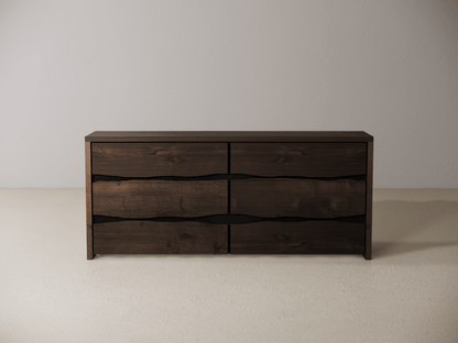 Wooden dresser with six drawers on a neutral background 