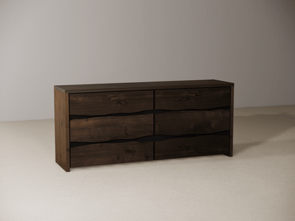 Wooden dresser with six drawers on a neutral background 