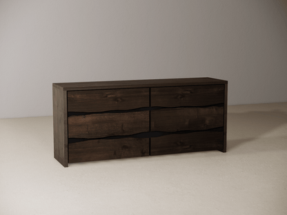 Wooden dresser with six drawers on a neutral background 