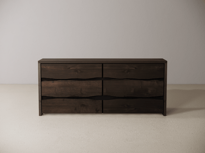 Wooden dresser with six drawers on a neutral background 